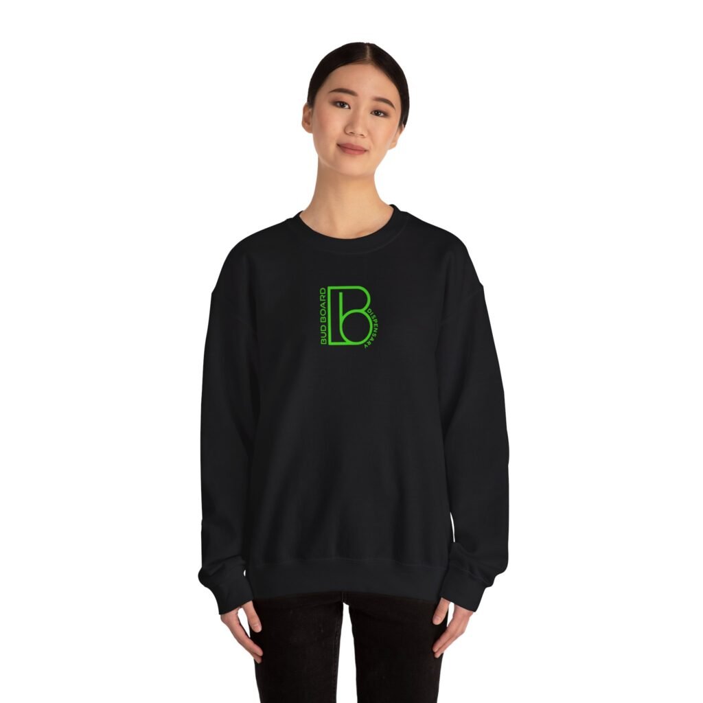 Model wearing black Bud Board Dispensary crewneck sweatshirt with green logo.