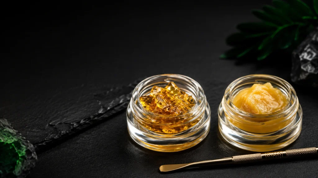 Live resin and rosin cannabis concentrates displayed side by side in small glass jars