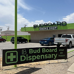 Exterior storefront of Bud Board Dispensary on Canyon Street in Carlsbad, New Mexico.